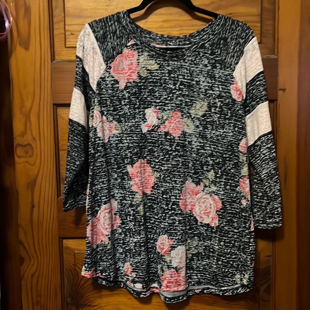 Mid length sleeve, floral top. New with tags.